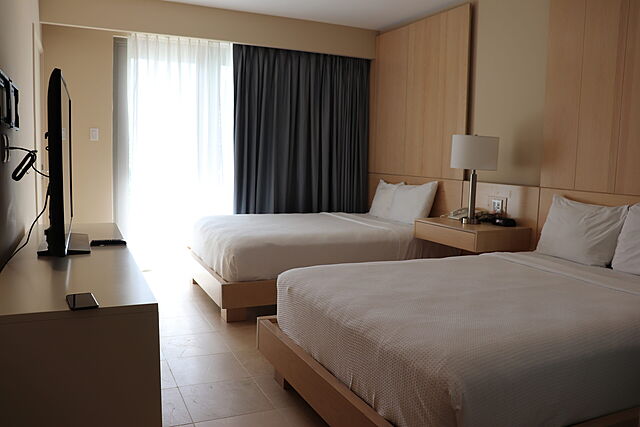 Sample unit bedroom with two queen beds.
