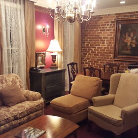 Very comfortable New Orleans-style living area with large dining table.