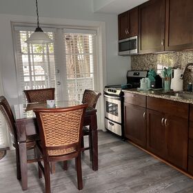 Kitchen and dining area looking toward back porch