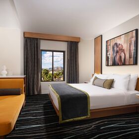 Bright Phase 2 king bedroom featuring refreshed tropical design and upgraded finishes.