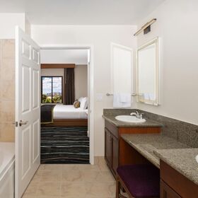 Updated Phase 2 bathroom with walk‑in shower, soaking tub, and refreshed fixtures.