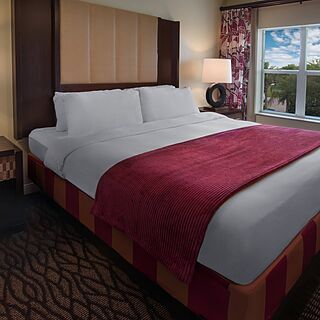 Marriott's Harbour Lake — Sample master bedroom in one- and two-bedroom villas (furniture and finishes vary from tower to tower).