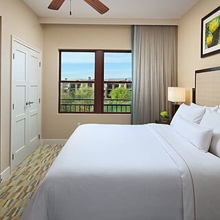 Westin Desert Willow — King bed in the bedroom of the larger one-bedroom and two-bedroom villas.