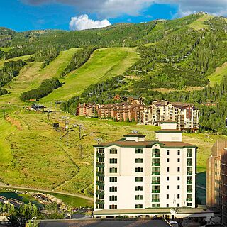 Sheraton Steamboat Resort Villas — Aerial View of Exterior and Nearby Mountain and Resort Ski Lift