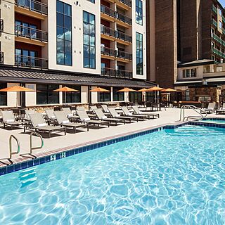 Sheraton Steamboat Resort Villas — Pool Area With Loungers and Umbrellas
