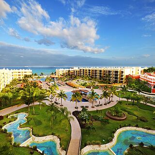Royal Haciendas — Sample Balcony View of Lazy River, Pools, and Beach