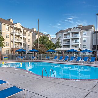 Club Wyndham Nashville — Pool With Loungers and Umbrellas (Playground Behind)