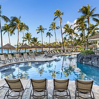 Marriott's Ko Olina Beach Club — Pool With Loungers and Umbrellas near Poolside Restaurant and Bar