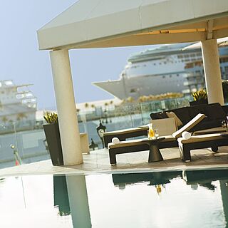 Renaissance Wind Creek Aruba - Ocean Suites — Pool Area With Loungers