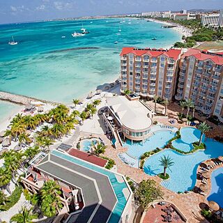 Divi Aruba Phoenix Beach Resort — Resort Grounds With Pool and Ocean View