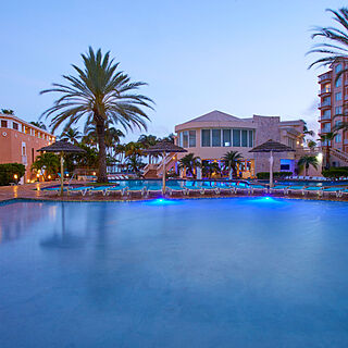 Divi Aruba Phoenix Beach Resort — Pool With Loungers and Umbrellas