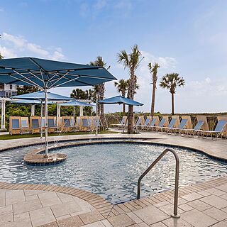 Marriott's SurfWatch — Pool With Shaded Loungers and Umbrellas
