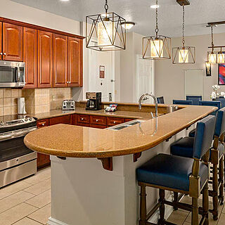 Club Wyndham Grand Desert — Sample Kitchen and Dining Area With Barstools (see below for unit-type specific photos)