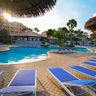 Divi Village Golf and Beach Resort &mdash; Pool With Loungers and Umbrellas