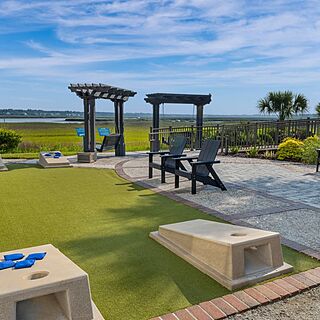 Marriott's Harbour Point and Sunset Pointe at Shelter Cove — Outdoor Activity Area With Cornhole and Porch Swings
