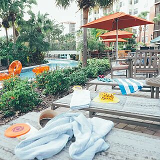Holiday Inn Club Vacations at Orange Lake Resort - River Island — Pool Area With Loungers and Umbrellas