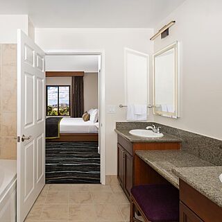 Updated Phase 2 bathroom with walk‑in shower, soaking tub, and refreshed fixtures.