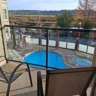 view of pool and river from balcony